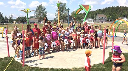 Lopes Splash pad grand opening, group of kids with thank you sign